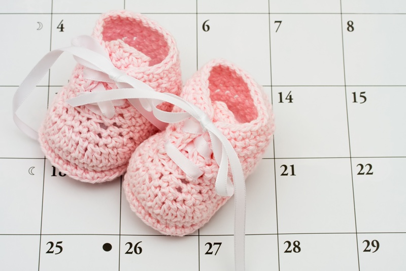 Baby shoes and calendar